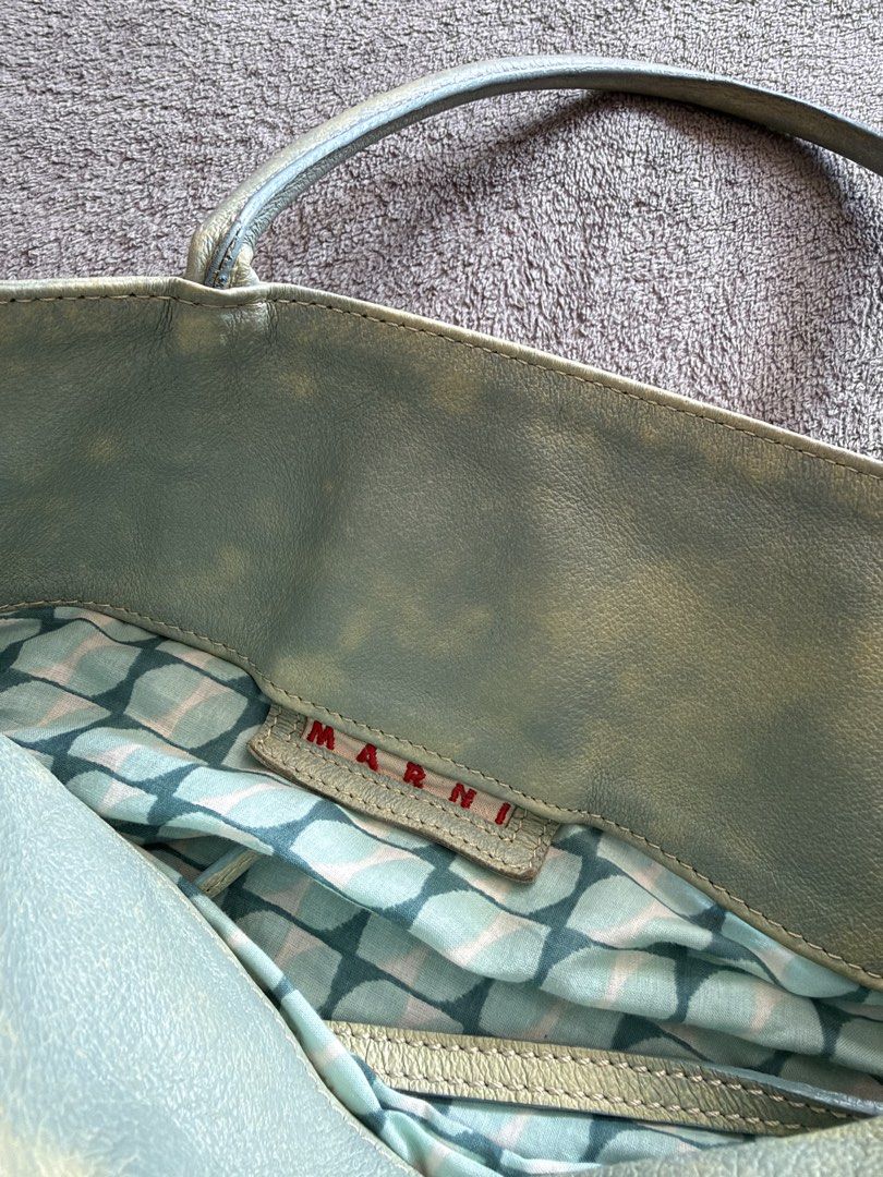 Marni Collapsible Bag (Category: Luxury Bags & Wallets) located in Lipa City. Submitted by bagabonds (Listing ID 1470398107, Image 3). Description: ‼️ With leather smell‼️ -The middle part is cloth and can be adjusted to make it longer - Has "Made in Italy" Tag inside -Good beach bag Drop your offers .