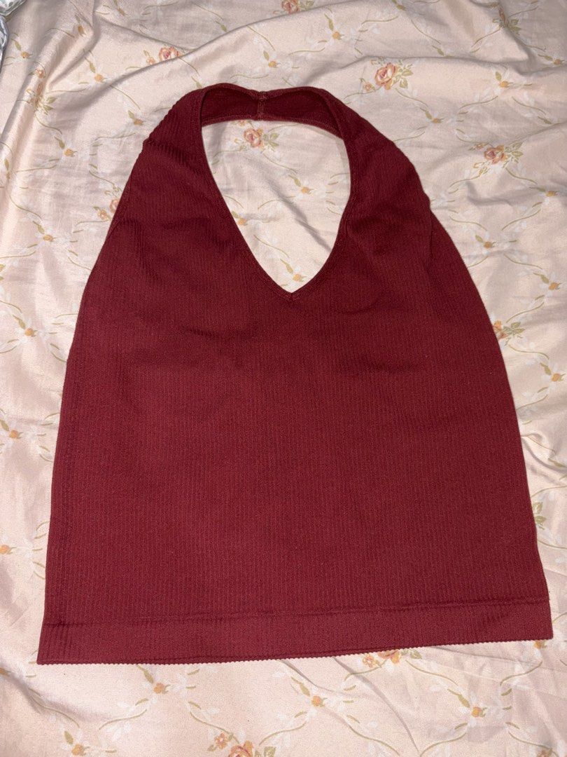 Maroon Ribbed Halter Neck Tank Top (Category: Sleeveless) located in Manila. Submitted by margascloset_ (Listing ID 1470475217, Image 1). Description: - Size is not indicated but can fit xs-small - Material: Stretchy ribbed knit fabric - Design: V-neck front, scoop back, halter style - Snug and flattering fit - Condition: good as new, worn only a few times .