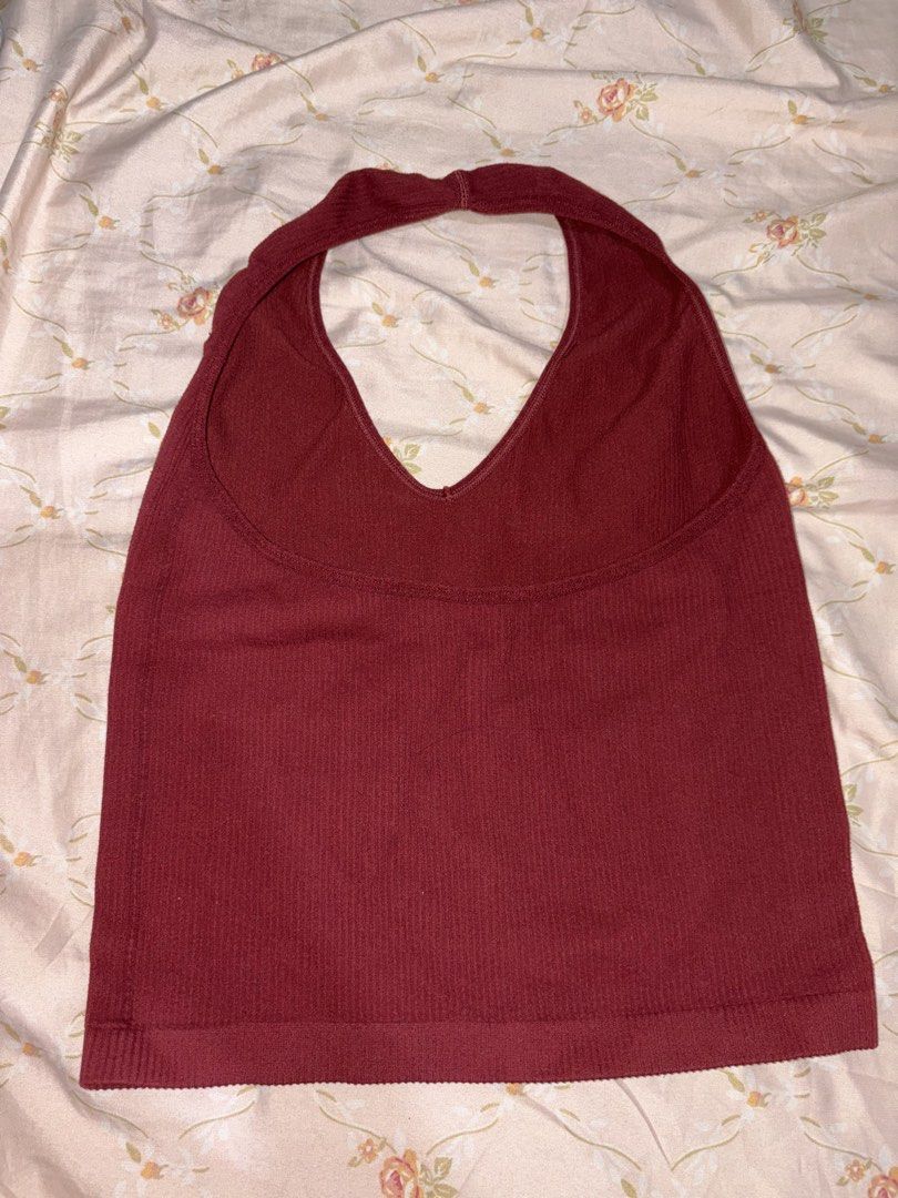 Maroon Ribbed Halter Neck Tank Top (Category: Sleeveless) located in Manila. Submitted by margascloset_ (Listing ID 1470475217, Image 2). Description: - Size is not indicated but can fit xs-small - Material: Stretchy ribbed knit fabric - Design: V-neck front, scoop back, halter style - Snug and flattering fit - Condition: good as new, worn only a few times .