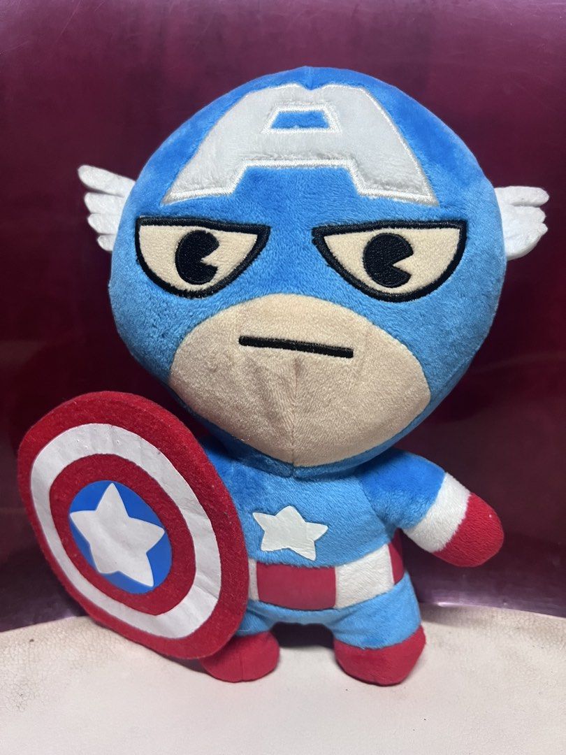 Marvel Broadway Collection 2017 Captain America Plush Toy (Category: Plushies & Soft Toys) located in Bulacan. Submitted by haven_plushie_dolls.888 (Listing ID 1470429484, Image 1). Description: - Item: Captain America Plush Toy - Collection: 2017 Broadway Collection (with official red Marvel tag) - Design: Blue suit, embroidered eyes/features, holding his signature round shield - Material: Ultra-soft fabric - Condition: Brand new/Mint - Perfect 