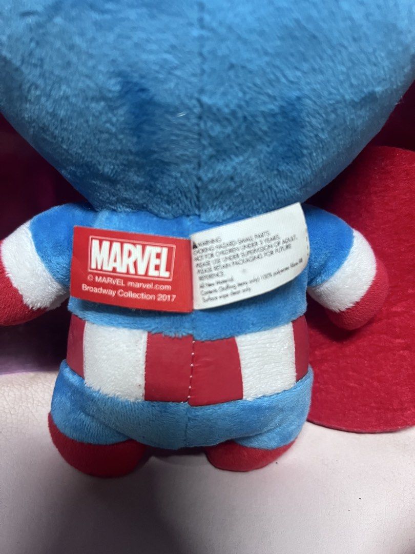 Marvel Broadway Collection 2017 Captain America Plush Toy (Category: Plushies & Soft Toys) located in Bulacan. Submitted by haven_plushie_dolls.888 (Listing ID 1470429484, Image 3). Description: - Item: Captain America Plush Toy - Collection: 2017 Broadway Collection (with official red Marvel tag) - Design: Blue suit, embroidered eyes/features, holding his signature round shield - Material: Ultra-soft fabric - Condition: Brand new/Mint - Perfect 