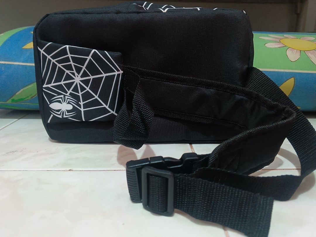 Marvel Spider-Man Black White Web Backpack (Category: Backpacks) located in Manila. Submitted by xxxmateo (Listing ID 1470390942, Image 2). Description: - Official Marvel merchandise with interior tag - Striking black design featuring a white spiderweb pattern - Large red and white Marvel logo box on the front - Edgy decorative zipper detail on the upper front - Adjustable black shoulder straps with secure buckle closure - Clean interior lining e