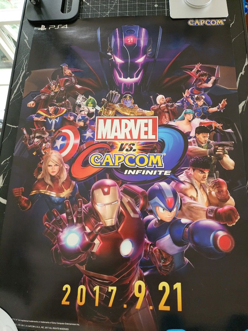 Marvel vs Capcom Infinite Promo Poster PS4 2017 (Category: PlayStation) located in Quezon City. Submitted by kristeenl556 (Listing ID 1470404879, Image 2). Description: - Official promotional poster for Marvel vs Capcom Infinite on PlayStation 4 - Features key art with Iron Man, Captain America, Ryu, Mega Man X, and more - Official release date (2017.9.21) printed on the side - Great wall decor for fighting game fans and collectors - Condition: B
