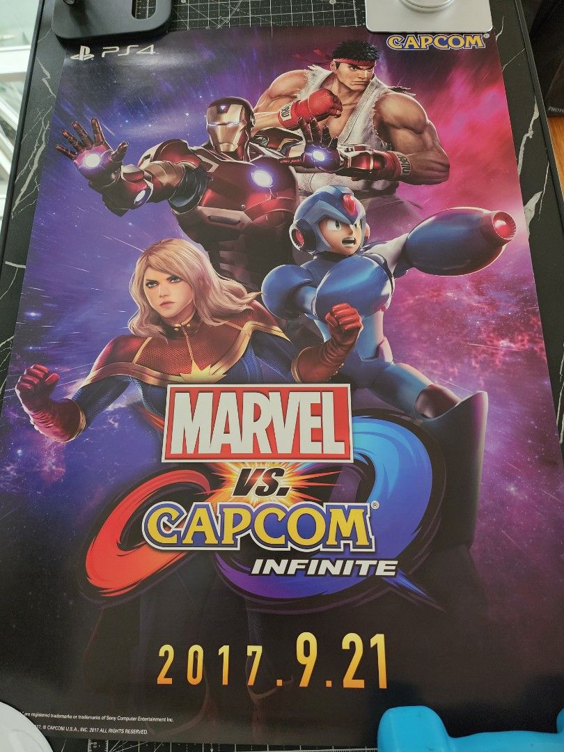 Marvel vs. Capcom: Infinite Promotional Poster PS4 (Category: PlayStation) located in Quezon City. Submitted by kristeenl556 (Listing ID 1470405392, Image 3). Description: - Official promotional poster for Marvel vs. Capcom: Infinite on PS4 - Features iconic artwork of Ryu, Mega Man X, Iron Man, and Captain Marvel - Official release date (2017.9.21) printed on the side - Excellent wall decor for fighting game fans and collectors - Stored flat and