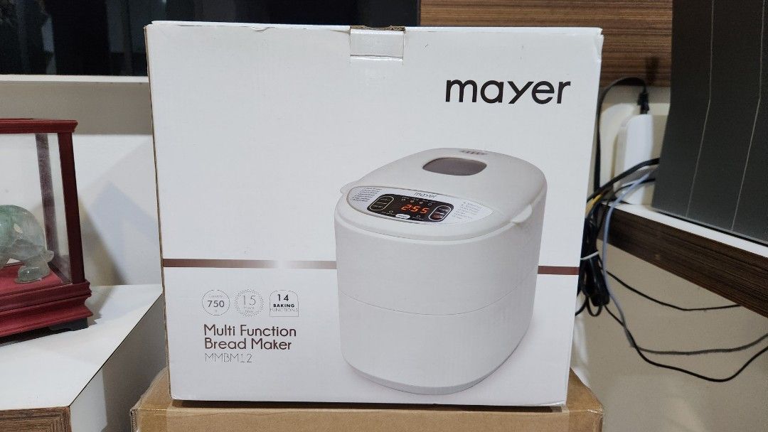 Mayer Multi Function Bread Maker MMBM12 (Category: Breadmakers) located in Singapore. Submitted by extremedeclutterer (Listing ID 1470545139, Image 1). Description: - Model: Mayer Multi-Function Bread Maker MMBM12 - Capacity: 750g - Features: 14 baking functions and 15-hour delay timer - Power: 220-240V, 530 watts - Condition: Tested, powers on, and digital display works - Includes: Baking pan, measuring cup, oven mitts, instruction manual, and o