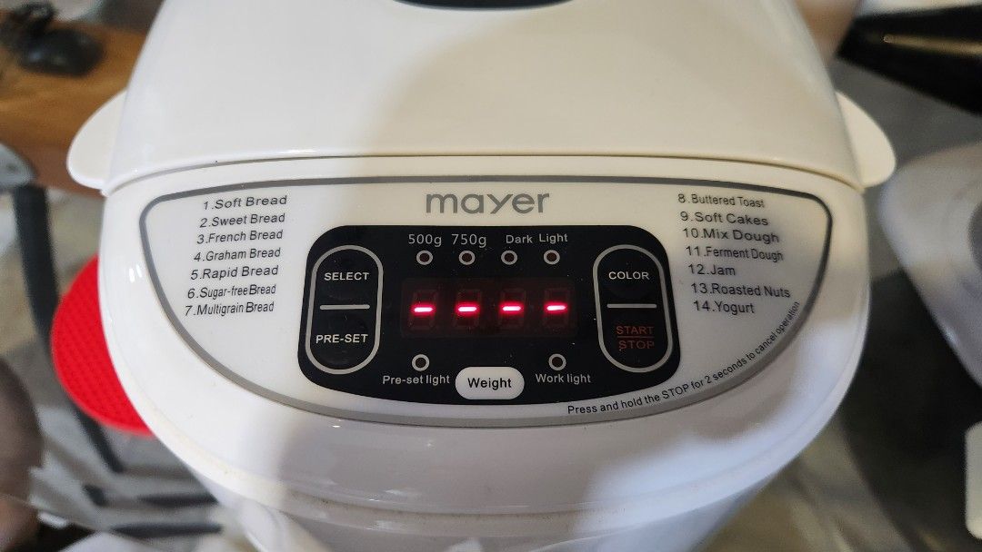 Mayer Multi Function Bread Maker MMBM12 (Category: Breadmakers) located in Singapore. Submitted by extremedeclutterer (Listing ID 1470545139, Image 4). Description: - Model: Mayer Multi-Function Bread Maker MMBM12 - Capacity: 750g - Features: 14 baking functions and 15-hour delay timer - Power: 220-240V, 530 watts - Condition: Tested, powers on, and digital display works - Includes: Baking pan, measuring cup, oven mitts, instruction manual, and o
