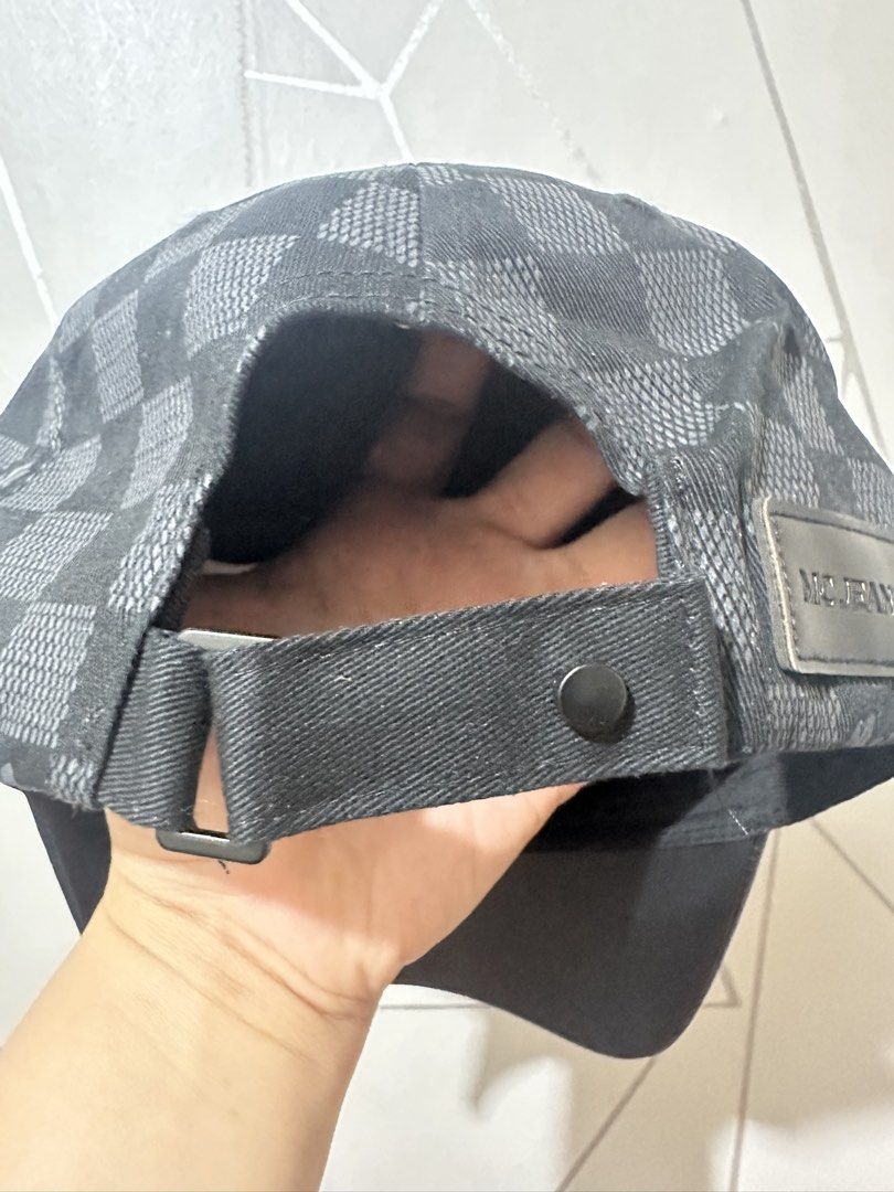 MC Jeans Checkered Cap Black Grey (Category: Caps & Hats) located in Manila. Submitted by aoparaiso (Listing ID 1470474303, Image 3). Description: - Brand: MC Jeans - Design: Black and grey checkered pattern with subtle 'Mc' script prints - Brim: Solid black faux leather - Fit: Adjustable strap at the back with a metal buckle and branded patch - Condition: Clean inside and out, great everyday hat that matches any outfit.