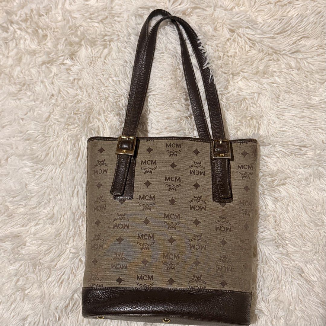 MCM Vintage Monogram Canvas (Category: Luxury Bags & Wallets) located in Pasay City. Submitted by erinsclosetph (Listing ID 1470505974, Image 2). Description: Vintage piece in Rank AB condition. Shows signs of age, including canvas discoloration, tarnished hardware, a dirty interior, and scratches on the top corner of the canvas. More pictures available upon request. No inclusions. .
