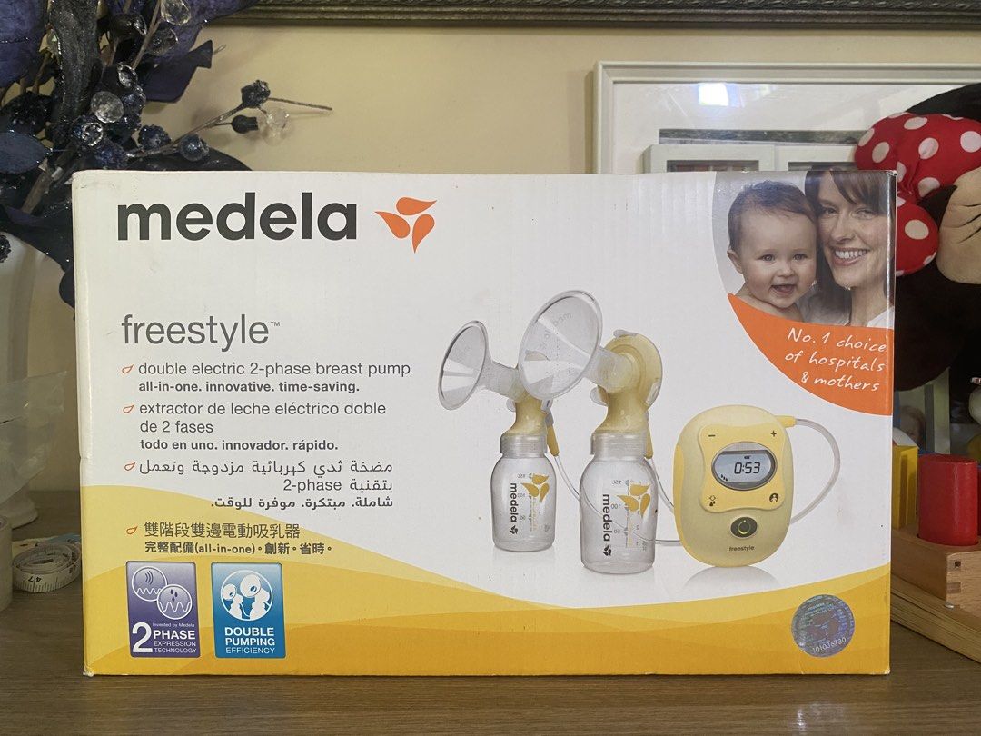 Medela Freestyle Double Electric Breast Pump Set (Category: Breastfeeding & Bottle Feeding) located in Santa Rosa. Submitted by hoardqueensdeclutter (Listing ID 1470459806, Image 1). Description: Medela Freestyle double electric breast pump. Includes the main motorized unit, two breast shields, yellow pump stands, tubing, multiple bottles, cooler bag with blue ice pack, and black carry tote bag. Original box included. Everything packed neatly..