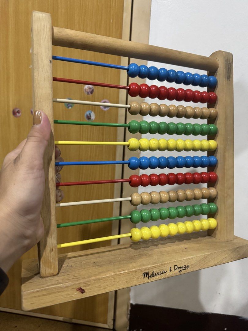 Melissa & Doug Wooden Abacus Counting Toy (Category: Educational & Learning Toys) located in Pasig City. Submitted by rodzrox (Listing ID 1470510739, Image 1). Description: - Authentic Melissa & Doug solid wooden abacus - Brightly colored beads in blue, red, natural wood, green, and yellow - Smooth wooden frame and rods for easy sliding - Traditional design perfect for counting and early math practice - Sturdy, durable construction made to last -