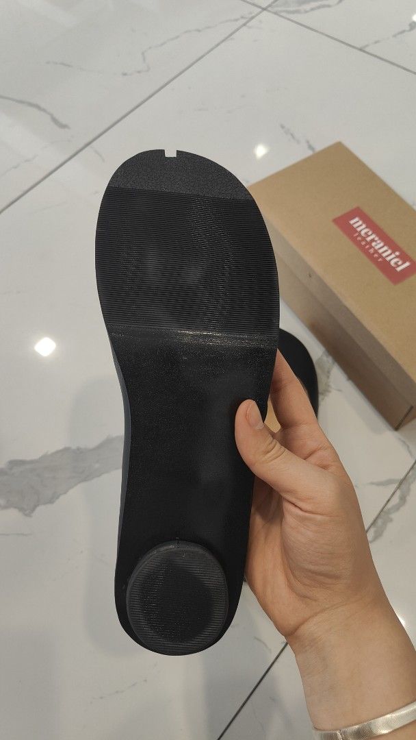 Meraniel Leather Black Split Toe Tabi Heels Shoes (Category: Heels) located in San Juan City. Submitted by gombanwa (Listing ID 1470394638, Image 3). Description: - Brand: Meraniel - Color: Classic Black, semi-matte - Size: US 10 (26cm) - Style: Split toe design with chic side cutout straps - Heel: small low heel (1 inch) - Details: Inner gold stamp branding - Origin: Proudly handcrafted in Marikina (tag included) - Condition: Brand new, never wo