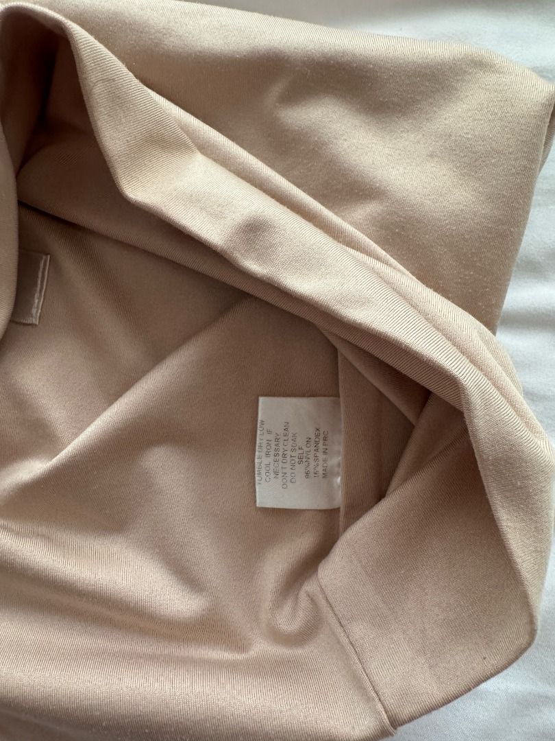 MESHKI Nude Spaghetti Strap Crop Top Size S (Category: Sleeveless) located in Cebu City. Submitted by _t.rix (Listing ID 1470382385, Image 3). Description: - Brand: Mesuki - Size: Small (tag attached) - Color: Nude - Material: 95% nylon, 5% spandex (super stretchy & comfortable) - Style: Tube top crop top with ultra-thin spaghetti straps and minimalist design - Care: Hand wash cold, cool iron if needed (no dry clean or soak).