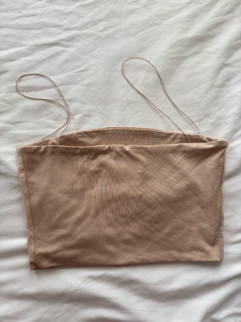 MESHKI Nude Spaghetti Strap Crop Top Size S (Category: Sleeveless) located in Cebu City. Submitted by _t.rix (Listing ID 1470382385, Image 1). Description: - Brand: Mesuki - Size: Small (tag attached) - Color: Nude - Material: 95% nylon, 5% spandex (super stretchy & comfortable) - Style: Tube top crop top with ultra-thin spaghetti straps and minimalist design - Care: Hand wash cold, cool iron if needed (no dry clean or soak).