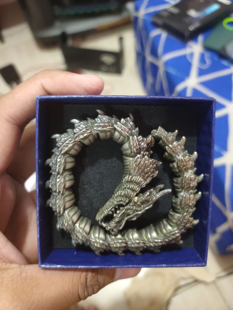 Metal Dragon Bracelet in Blue Box (Category: Bracelets) located in Manila. Submitted by warmstone_3189cf (Listing ID 1470541394, Image 2). Description: - Design: Double-headed dragon with intricate scale details - Style: Heavy metal link bracelet with a sleek metallic finish - Condition: Clean piece, meticulously stored - Packaging: Includes the original small blue box - Perfect for statement looks or as a gift.