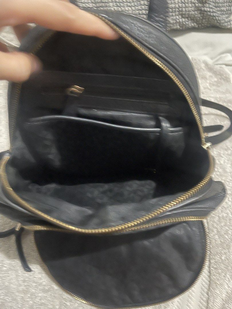 Michael Kors Black Pebbled Leather Backpack (Category: Backpacks) located in Manila. Submitted by miss.arpee (Listing ID 1470502686, Image 3). Description: - Brand: Michael Kors - Material: Black pebbled leather with gold-tone hardware - Storage: Main compartment with interior zip and slip pockets, plus a front zippered pocket - Comfort: Adjustable shoulder straps and top grab handle - Lining: Durable fabric interior - Condition: Excellent everyd