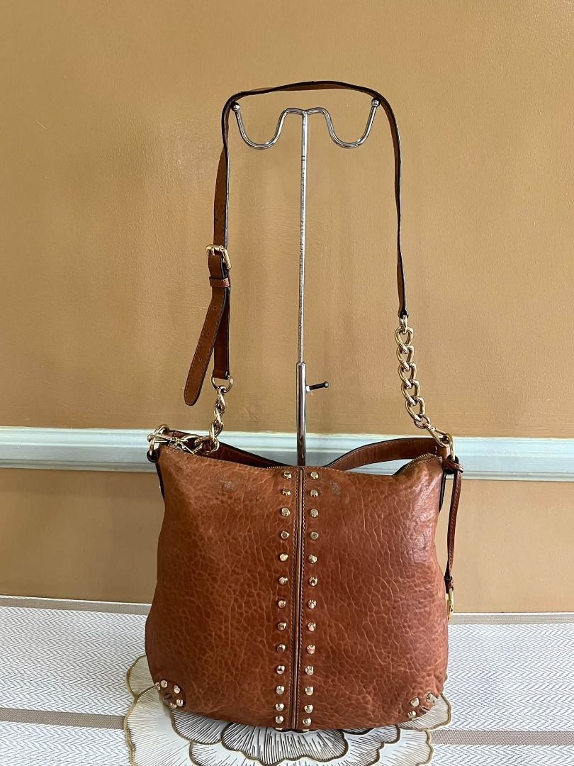 Michael Kors Brown Leather Studded Shoulder Bag (Category: Luxury Bags & Wallets) located in Quezon City. Submitted by bellafashion08 (Listing ID 1470361556, Image 3). Description: Dimension: - Height = 11 in. - Length = 12 in. * From U.S * Nice in actual .