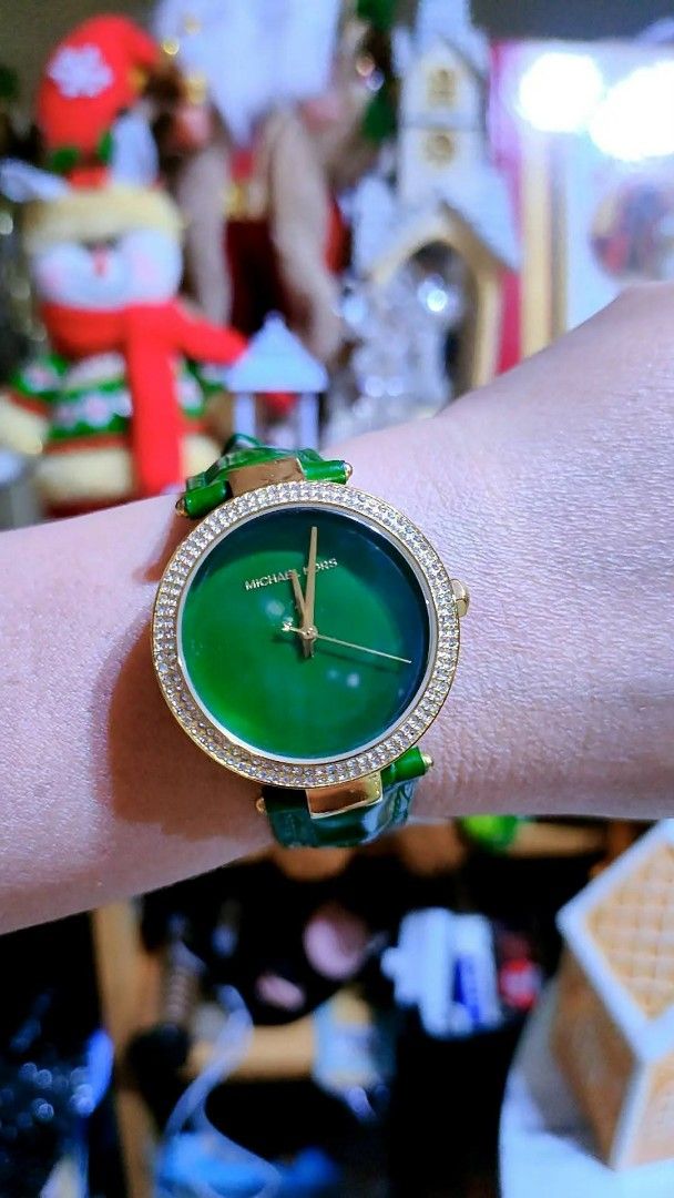 Michael Kors Green Dial Watch MK-2592 (Category: Women's Watches) located in Baliuag. Submitted by marieannfernando23 (Listing ID 1470366969, Image 2). Description: - Brand: Michael Kors (Model: MK-2592) - Dial: Striking green dial with a dazzling crystal bezel - Case: Elegant gold-tone case with 10 ATM water resistance - Strap: Shiny green leather strap with minimal wear - Condition: Clean crystal face, well-maintained .