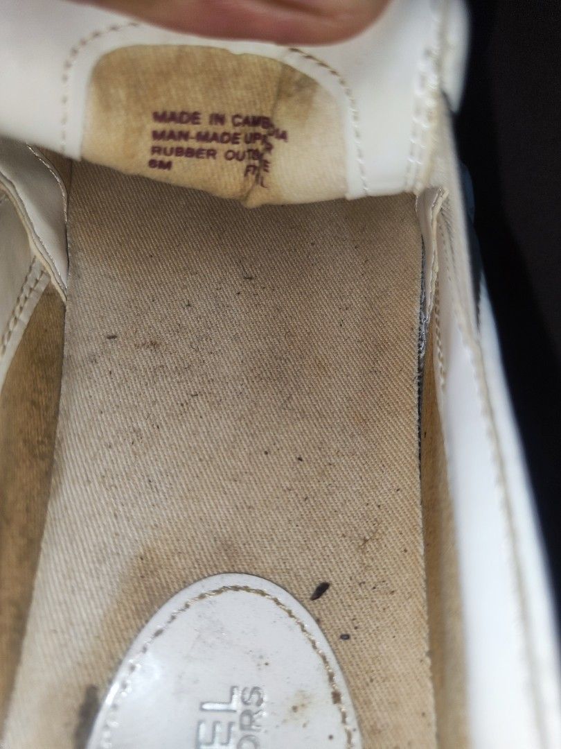 Michael Kors Slip-On Sneakers Size 6M White Monogram (Category: Sneakers) located in Paniqui. Submitted by arlenepari29210 (Listing ID 1470497658, Image 3). Description: - Brand: Michael Kors - Style: Slip-on sneakers with elastic side gores - Color/Pattern: Classic white all-over MK monogram - Size: 6M - Material: Man-made upper and rubber outsole - Origin: Made in Cambodia - Condition: Pre-owned with regular wear on soles and insoles - Features
