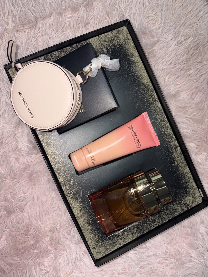 Michael Kors Wonderlust Gift Set (Category: Fragrance & Deodorants) located in Manila. Submitted by xyhanix (Listing ID 1470365511, Image 2). Description: 1 gift box available Items are originally shipped from the US - 100% Authentic Michael Kors Wonderlust fragrance gift set - Includes a large perfume bottle and matching scented body lotion - Comes with a chic blush pink zippered coin pouch / bag charm - Packaged in the original black presentati