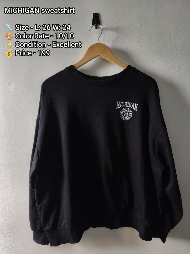 MICHIGAN sweatshirt (Category: Coats, Jackets and Outerwear) located in Manila. Submitted by gelog2 (Listing ID 1470480505, Image 1). Description: - Color: Rich black with no fading - Size: Large (Length: 26", Width: 24") - Design: Small Michigan chest print with large white textured back graphics including 'CONFIDENCE', 'DETROIT MIND', 'SINCE 74', 'WEST RANGE', and 'GREAT FORCE' - Condition: Clean, excellent pre-loved condition.