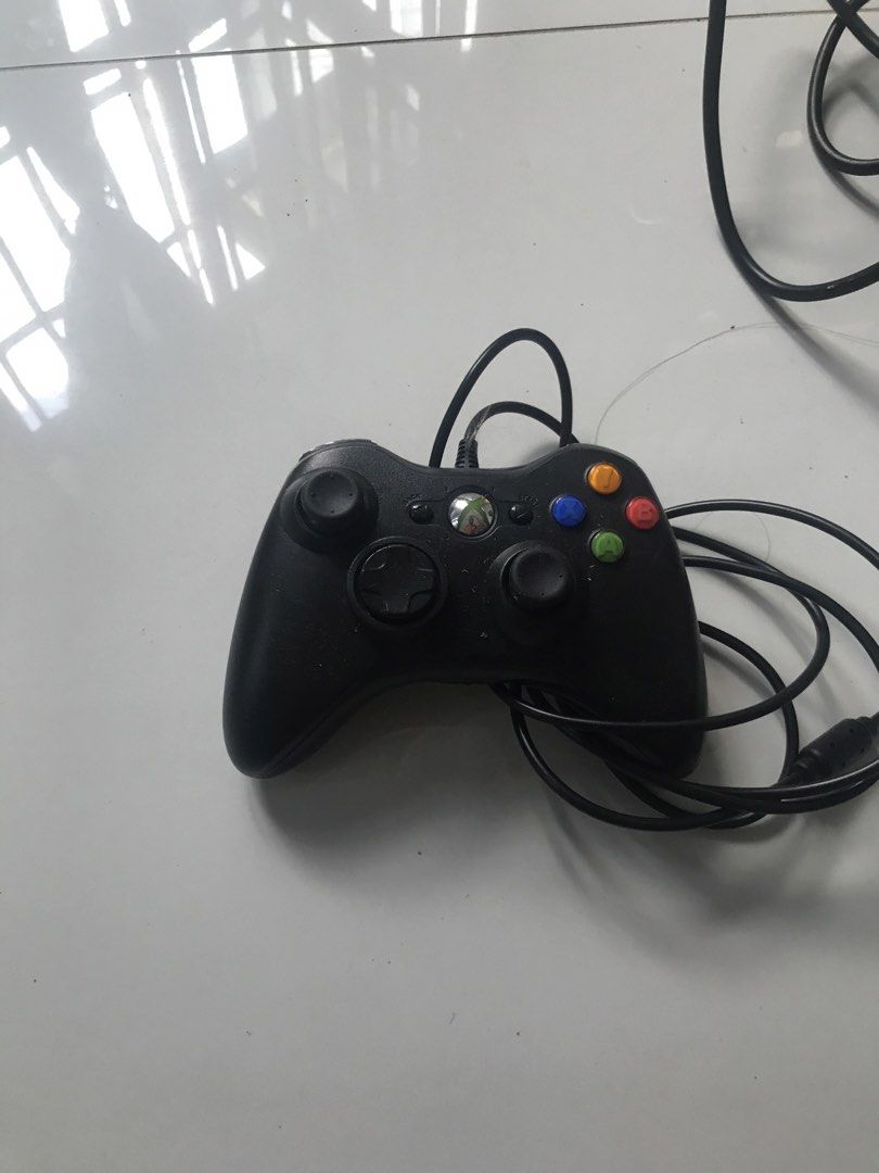 Xbox 360 Slim Console Bundle with Controller and Games (Not-Jtag/RGH) (Category: Xbox) located in Agoncillo. Submitted by miguelitobingphilippines (Listing ID 1470386043, Image 2). Description: - Item: Black Microsoft Xbox 360 Slim Console Bundle - Condition: Clean, tested, and ready to set up and play - Controller: 1x wired black controller included - Accessories: Original power brick included - Physical Games: Call of Duty Black Ops III & Halo 