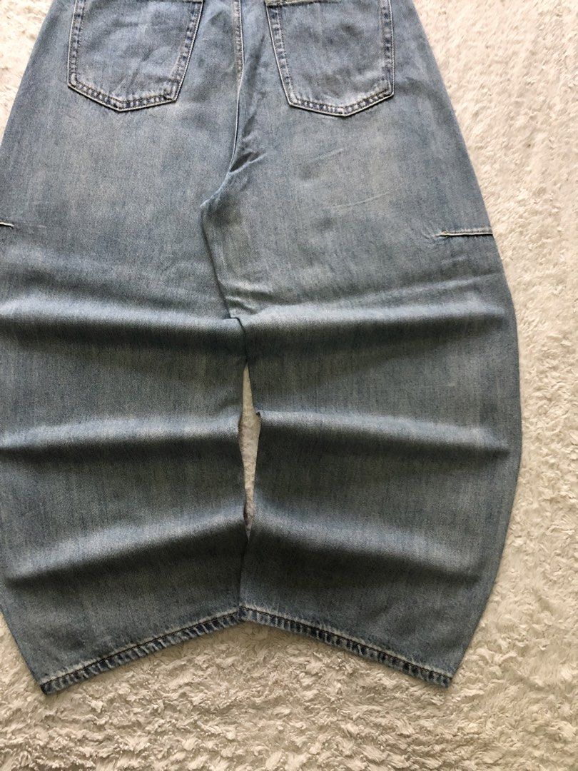 mid-wash blue denim, Barrel-leg pants (Category: Jeans) located in Canaman. Submitted by thriftmoboss (Listing ID 1470454593, Image 3). Description: 📌 mid-wash blue denim, Barrel-leg pants ___________________________ No available model ___________________________ 📏DIMENSION (INCHES) Waistline:30 length:40 tight:14 leg opening:10.5 ___________________________ ♻️DETAILS Condition:good condition Color rate:9.5/10 Fabric used:soft denim Issues:N/A 