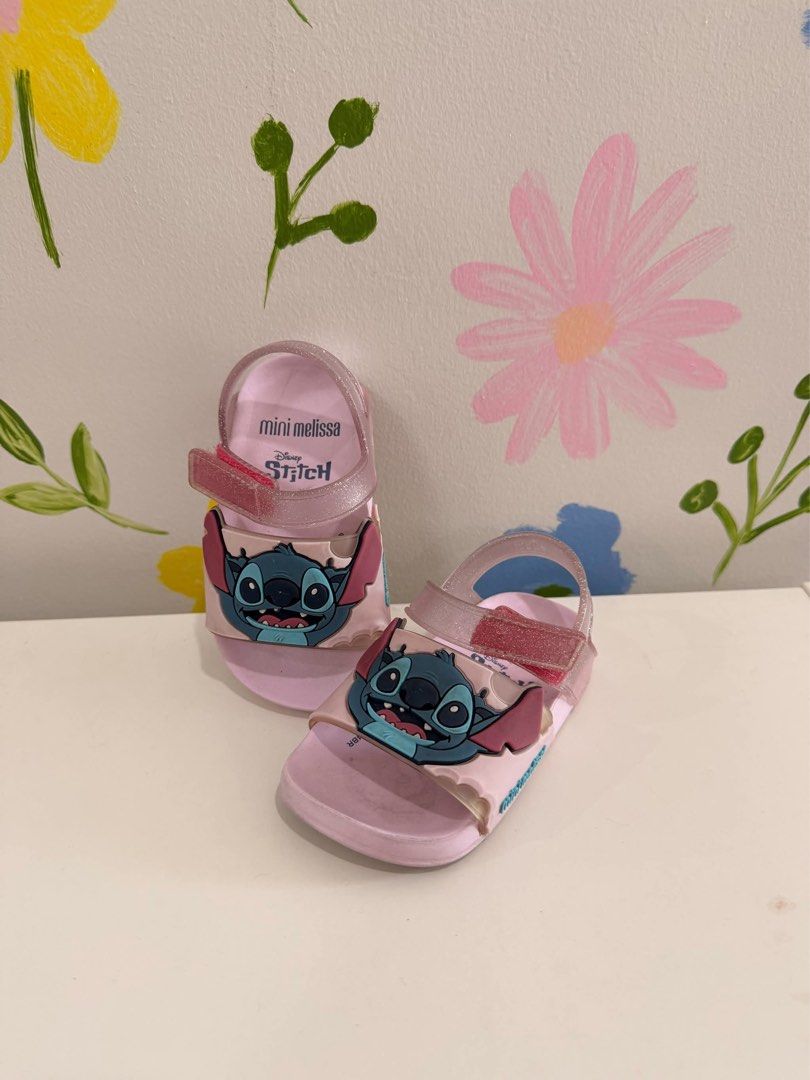 Mini Melissa Disney Stitch Pink Sandals (Category: Babies & Kids Fashion) located in Manila. Submitted by ang.cass (Listing ID 1470407388, Image 2). Description: - Brand: Mini Melissa - Size 21 - Closure: Easy Velcro strap across the top - Material: Soft, flexible, and comfortable jelly material - Condition: rarely used .