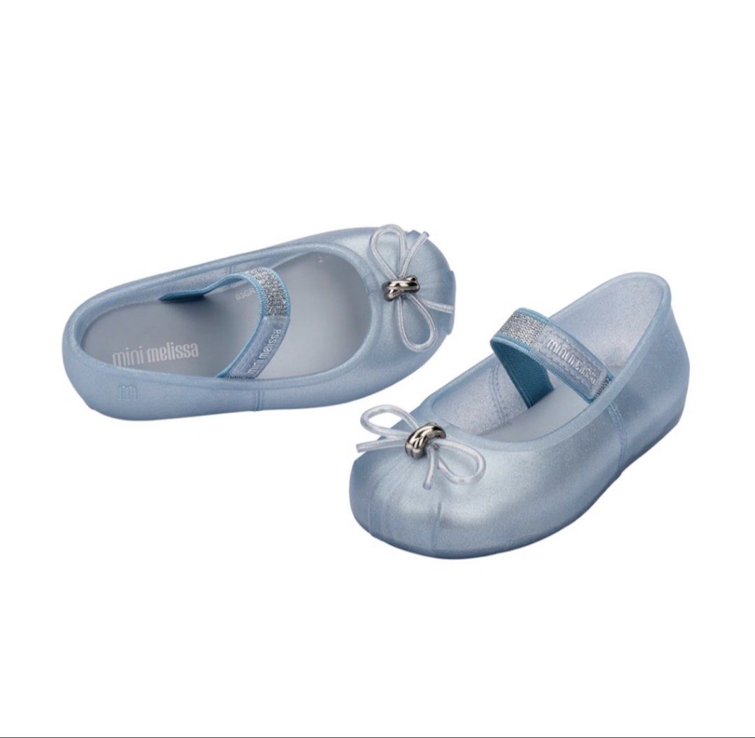 Mini Melissa Glitter Ballet Flats (Category: Babies & Kids Fashion) located in Silang. Submitted by gelobitspieces (Listing ID 1470411882, Image 1). Description: - Brand: Mini Melissa - Style: Glitter ballet flats / Mary Jane with elastic strap and front bow - Color: Light blue - Size: EUR 27 / USA 10 / JPN 16.5 - Condition/Inclusions: Original box included - Perfect footwear choice for little ones.
