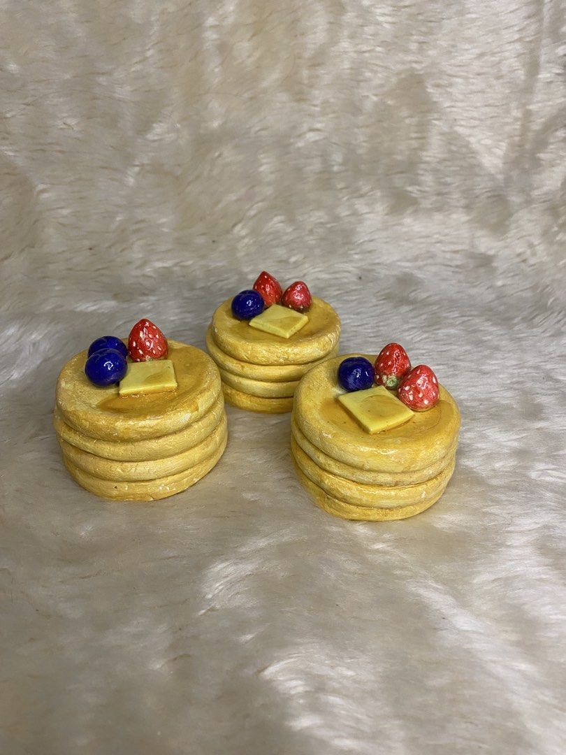 Miniature Pancake Stack Trinket (Category: Accessory Holder, Box & Organizers) located in Manila. Submitted by littleatorie.studio (Listing ID 1470543758, Image 2). Description: - Miniature pancake stack displays - Features detailed toppings: butter, blueberries, and strawberries - Glossy glazed finish looks just like real syrup - Perfect fun decor for your desk, dollhouse, or kitchen shelf - Best for storing rings, jewelries,keys.