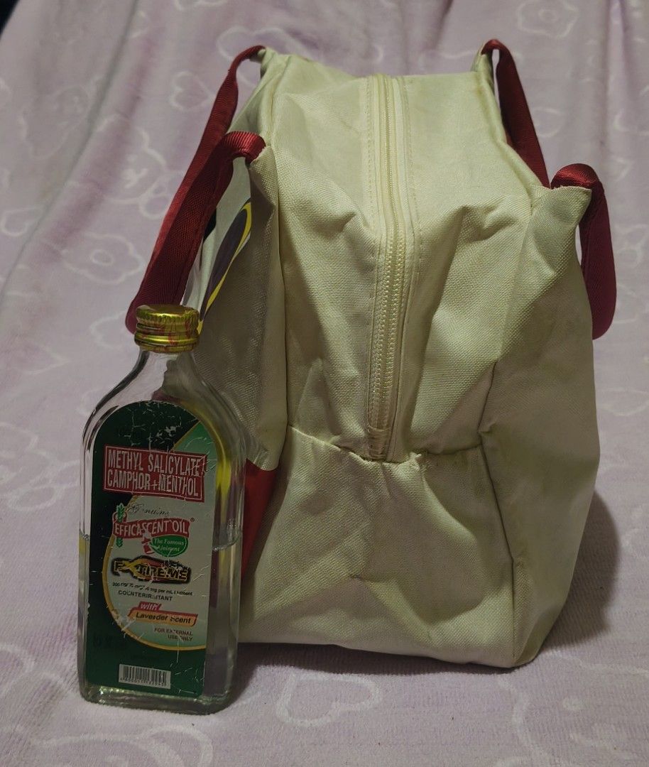 Miniso Hedwig Bag (Official Harry Potter Collaboration) (Category: Purses & Pouches) located in Villasis. Submitted by bunnybabe08 (Listing ID 1470485417, Image 3). Description: • Brand: Miniso (Official Harry Potter Collaboration) • Material: Canvas / Polyester Blend • Color/Hardware: Off-White with Red and Yellow Color-Blocking / Gold-Tone Zipper • Condition: Pre-owned condition with slight visible usage. Features a vibrant Hedwig graphic with 