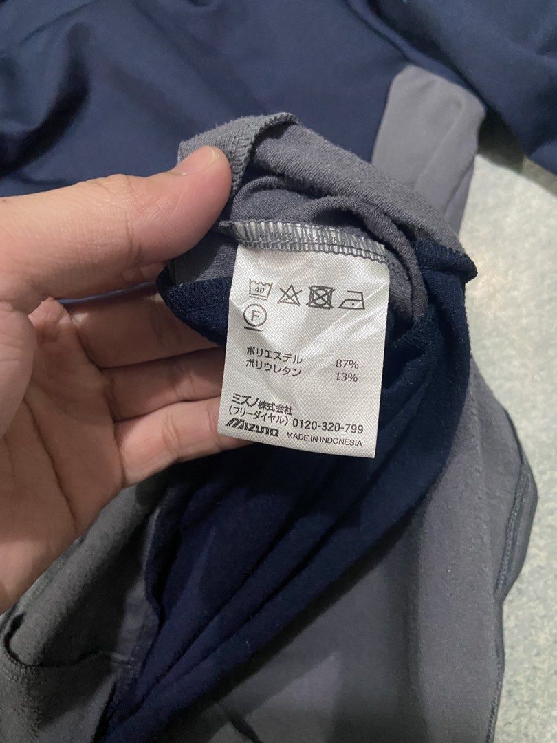 Mizuno Training Jacket size Small (Category: Coats, Jackets and Outerwear) located in Baguio. Submitted by chicoroy (Listing ID 1470465692, Image 3). Description: - Brand: Mizuno - Color: Navy blue with grey side panels and light blue accents - Size: S Dimes:20/25 Need wash only - Material: 87% polyester, 13% polyurethane blend - Origin: Made in Indonesia - Features: Front half-zip, Mizuno logo on chest and sleeve Baguio location can ship JNT.