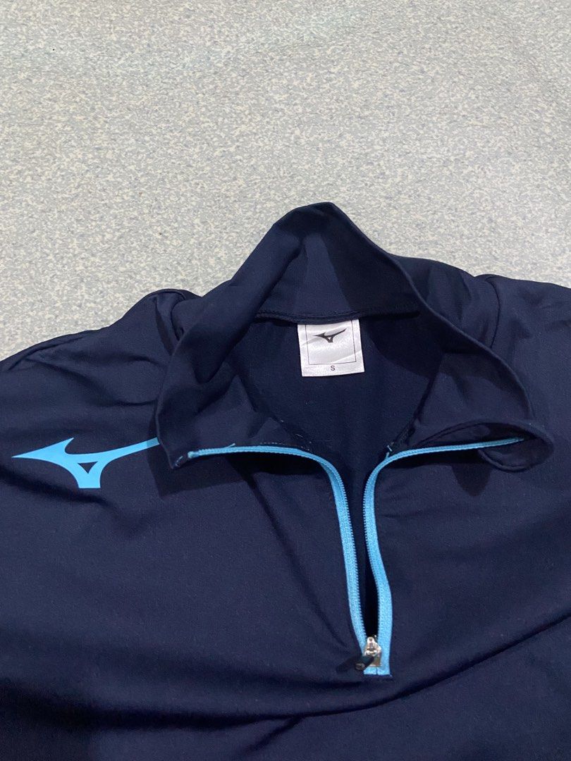 Mizuno Training Jacket size Small (Category: Coats, Jackets and Outerwear) located in Baguio. Submitted by chicoroy (Listing ID 1470465692, Image 2). Description: - Brand: Mizuno - Color: Navy blue with grey side panels and light blue accents - Size: S Dimes:20/25 Need wash only - Material: 87% polyester, 13% polyurethane blend - Origin: Made in Indonesia - Features: Front half-zip, Mizuno logo on chest and sleeve Baguio location can ship JNT.