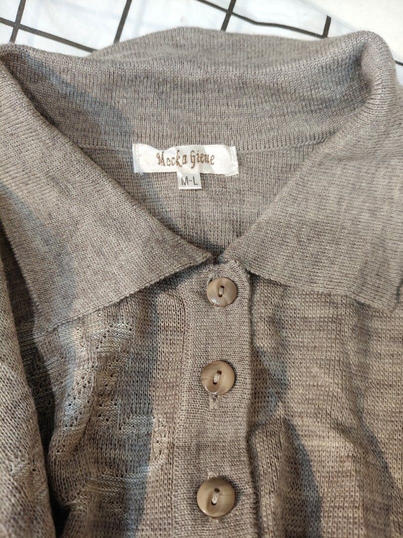Mocka Giene Grey Knit Polo Sweater M-L No issues (Category: Longsleeves) located in Bulacan. Submitted by alyssarys (Listing ID 1470535546, Image 2). Description: - Brand/Model: Mocks Giene - Size: M-L - Color: Grey - Material: Lightweight stretch knit - Details: Collared neckline, button placket, ribbed cuffs and hem - Style: Clean look, versatile for pairing with skirts or trousers.