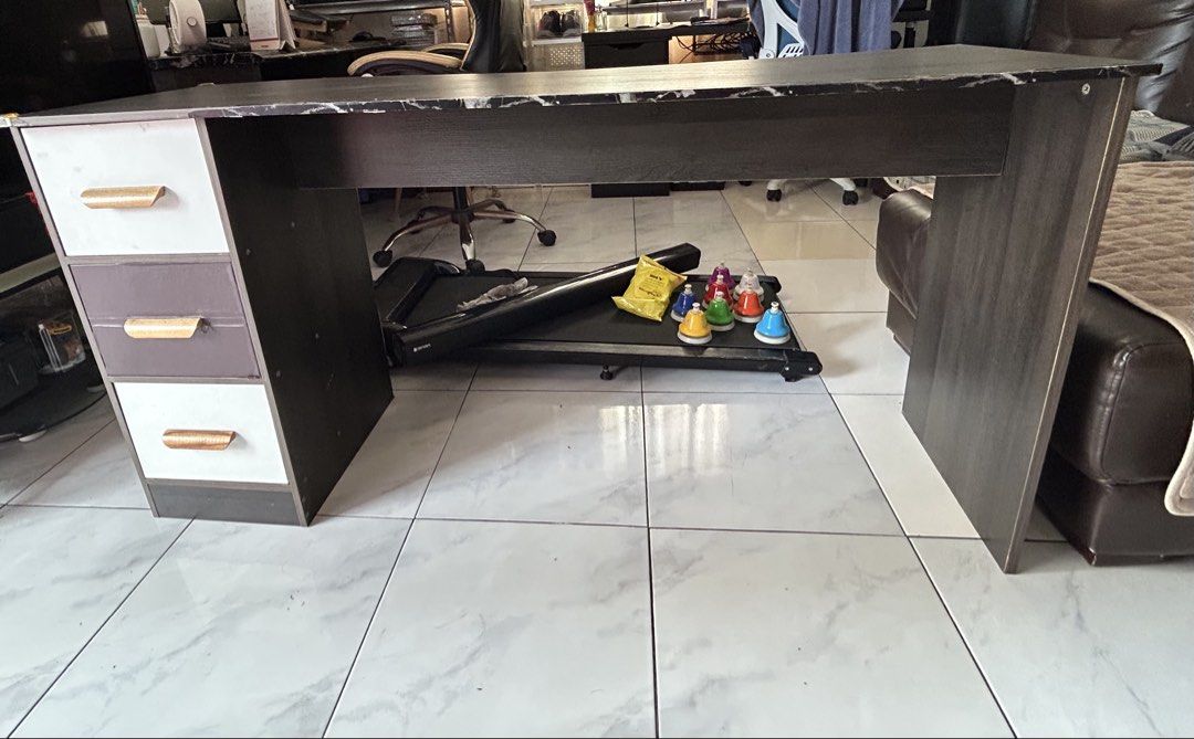Modern Dark Wood Study Desk with Three Drawers (Category: Tables & Sets) located in Pasig City. Submitted by puretree.f2718a (Listing ID 1470370499, Image 1). Description: - Dark wood finish with an elegant faux marble top - 3 pull-out drawers on the left with white and dark grey faces - Stylish gold-tone drawer handles - Sturdy panel legs for maximum durability - Spacious legroom underneath, perfect for rolling office chairs - Ideal work surface