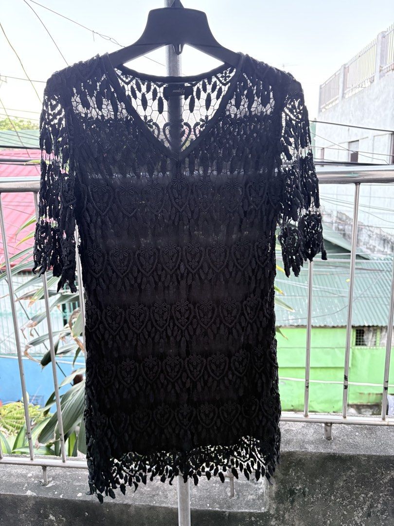 Modify Black Lace Dress V-Neck (Category: Dresses) located in Cavite. Submitted by earthread (Listing ID 1470453750, Image 1). Description: - Brand: Modify - Color: Black - Design: Intricate lace pattern, half sleeves, V-neckline with inner lining, scalloped hem - Versatility: Great for evening outings or casual events; easy to style with boots or heels -Slightly Heavy dress.