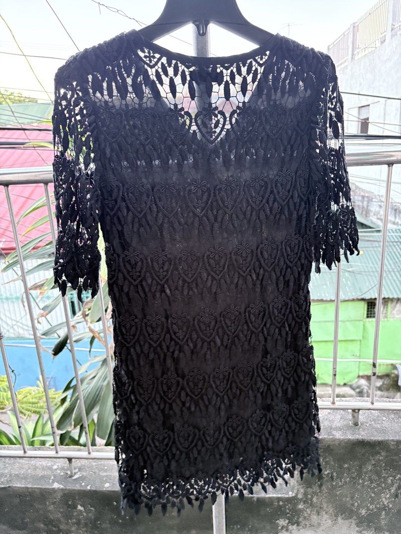 Modify Black Lace Dress V-Neck (Category: Dresses) located in Cavite. Submitted by earthread (Listing ID 1470453750, Image 2). Description: - Brand: Modify - Color: Black - Design: Intricate lace pattern, half sleeves, V-neckline with inner lining, scalloped hem - Versatility: Great for evening outings or casual events; easy to style with boots or heels -Slightly Heavy dress.