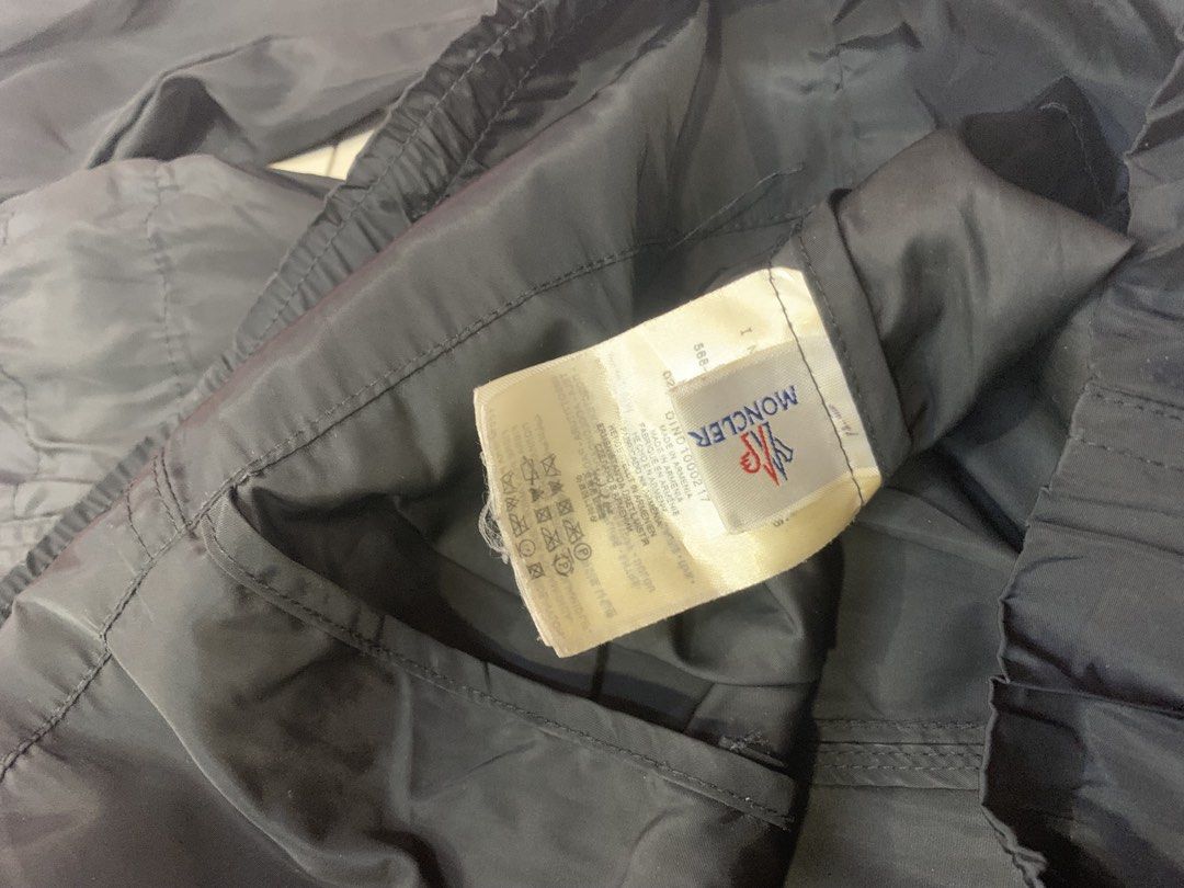 Moncler Black Hooded Windbreaker Jacket Size 3 (Category: Luxury Apparel) located in Tarlac. Submitted by luxurious_apparel (Listing ID 1470445266, Image 3). Description: - Authentic Moncler hooded windbreaker in classic black - Size: 3 (Marked on tag) - Full zip front with branded puller - Adjustable drawstring waist and elasticated cuffs - Iconic Moncler logo patch on the left sleeve - Lightweight and ideal for layering - Made in Armenia with i
