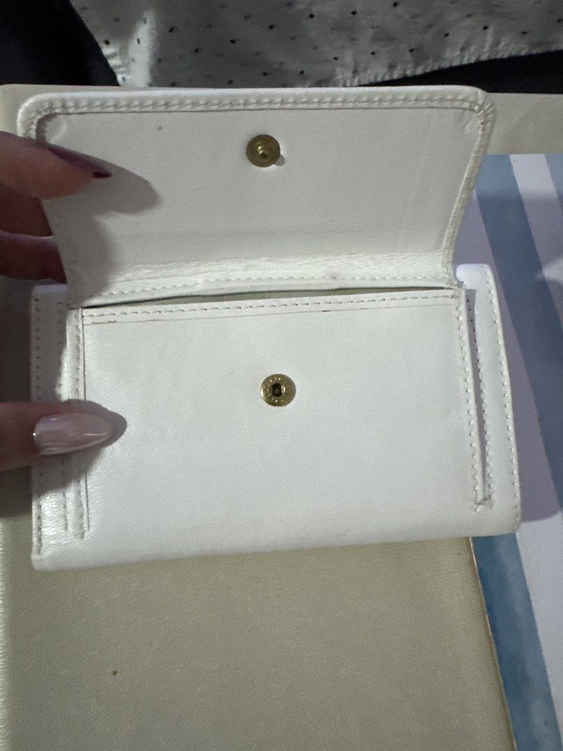 Montblanc Leather Wallet (Category: Wallets & Card Holders) located in Paranaque City. Submitted by zen_80 (Listing ID 1470353038, Image 3). Description: - Brand: Montblanc - Color: Black and White - Design: Compact daily carry with embossed logo - Storage: Multiple card slots, ID window, and spacious bill compartment - Closure: Secure flap with snap button - Condition: Brand new / Excellent quality - Mode of Payment: GCash, Bank Transfer, or COD