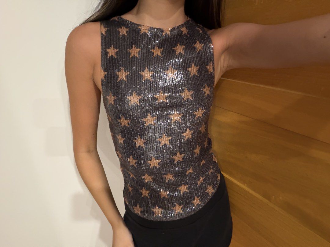 MOTEL ROCKS Sequin Star Print Sleeveless Top (Category: Sleeveless) located in Muntinlupa City. Submitted by closet.natalia (Listing ID 1470477907, Image 1). Description: MOTEL ROCKS Sequin Star Print Sleeveless Top ● Brand: MOTEL ● Size: XXS ● Color: Dark grey with brown stars ● All-over sequin detailing with star print ● Sleeveless with round neckline ● Fitted silhouette ● Fully lined 📌 Condition: Brand new, never been worn 📌 RFS: Not my styl