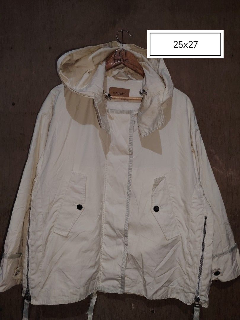Moussy Off-White Hooded Jacket Size Free (Category: Coats, Jackets and Outerwear) located in Roxas, Palawan. Submitted by act_thrift_palawan (Listing ID 1470351259, Image 1). Description: - Brand: Moussy - Color: Off-White - Size: Free Size (25" x 27") - Material: 100% Cotton shell with Polyester & Rayon lining - Closure: Full zip front with snap buttons - Features: Adjustable drawstring hood and waist, stylish side zippers at the hem - Origin: M