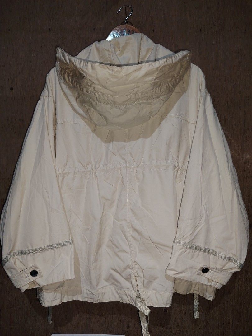 Moussy Off-White Hooded Jacket Size Free (Category: Coats, Jackets and Outerwear) located in Roxas, Palawan. Submitted by act_thrift_palawan (Listing ID 1470351259, Image 3). Description: - Brand: Moussy - Color: Off-White - Size: Free Size (25" x 27") - Material: 100% Cotton shell with Polyester & Rayon lining - Closure: Full zip front with snap buttons - Features: Adjustable drawstring hood and waist, stylish side zippers at the hem - Origin: M
