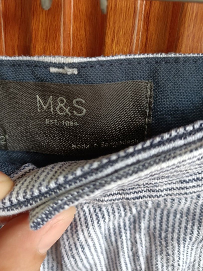 M&S Blue and White Striped Shorts (Category: Shorts) located in Bayombong. Submitted by rheaaa00530 (Listing ID 1470472980, Image 2). Description: - Brand: Marks & Spencer (M&S) - Design: Blue and white striped summer shorts - Features: Front button closure, belt loops, and functional side pockets - Fabric: Lightweight and comfortable for warm weather - Origin: Made in Bangladesh - Condition: Clean, excellent overall condition, and ready to wear.