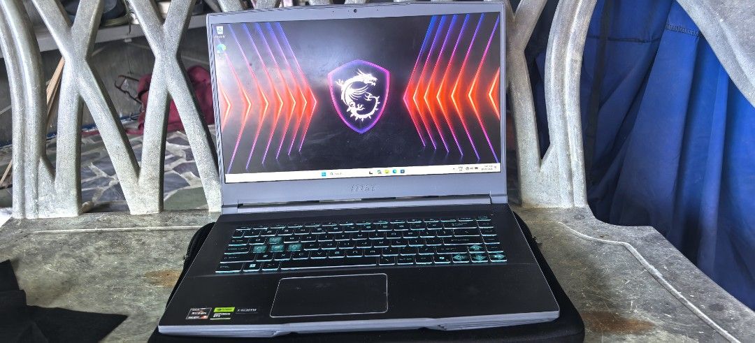 MSI Thin 15 Gaming Laptop Ryzen NVIDIA RTX (Category: Laptops & Notebooks) located in Abucay. Submitted by jerlynbal98316 (Listing ID 1470478264, Image 1). Description: - Brand/Model: MSI Gaming Laptop (Grey) - Processor: AMD Ryzen - Graphics: NVIDIA RTX - Display: Matte panel with MSI dragon logo wallpaper - Keyboard: Backlit with stylish cyan highlights on WASD keys - Condition: Kept clean, 100% working properly - Ideal For: Daily gaming sessio