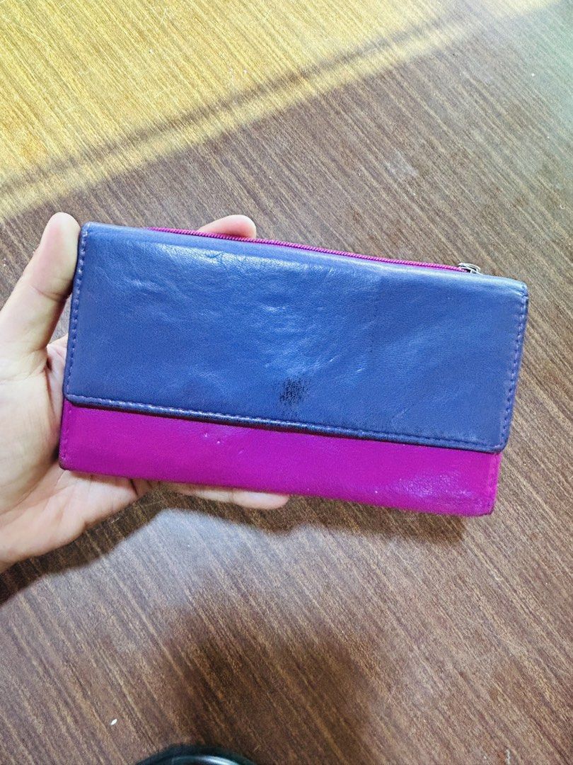 Multicolor Genuine Leather Long Wallet with Multiple Compartments (Category: Wallets & Card holders) located in Manila. Submitted by starbalesukandjapansurplus (Listing ID 1470555651, Image 1). Description: - Multi-colored genuine leather long wallet (blue, pink, yellow, green, and purple panels) - Secure front snap button closure - Multiple interior card slots, ID window, and slip pocket - Exterior backside zipped pocket and extra slot for quick