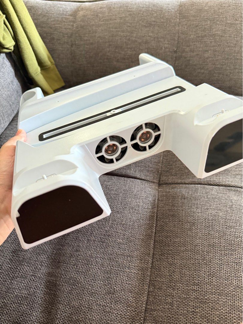 Multifunctional Cooling Charging Dock for PS5 (Category: Cables & Chargers) located in Manila. Submitted by bea1408 (Listing ID 1470400682, Image 1). Description: - bought in Datablitz - good as new, no issue .
