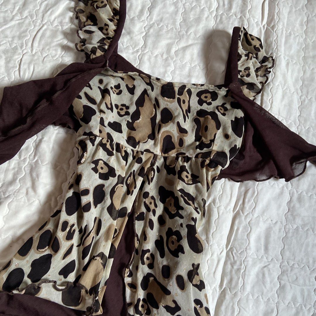 Nai-Fi Leopard Print Ruffle Tanking Top (Category: Sleeveless) located in Libungan. Submitted by whimsyypetal (Listing ID 1470550449, Image 3). Description: - Brand: Nai-Fi - Size: Medium (Tag attached) - Print: Brown leopard animal print with subtle metallic gold sparkle threads - Design: Scoop neckline, front tie bow detail, ruffled straps and hem - Material: Lightweight mesh - Condition: Brand new with tags.