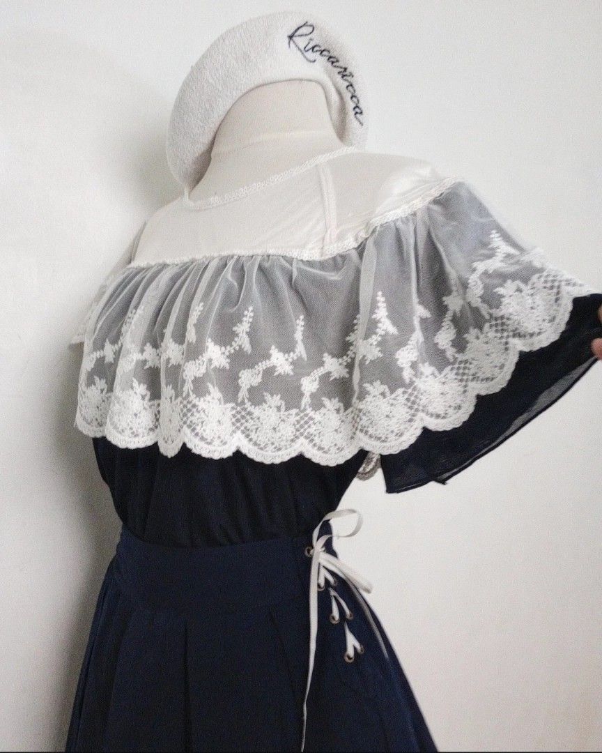 Navy Blue Axes Femme Coord Set (Category: Sets or Coordinates) located in Balanga. Submitted by marae_c (Listing ID 1470553875, Image 3). Description: Both axes femme In very good condition. Classic style navy blue coords. Lace overlay design sa top. Pa scallop layer yung bodice with flowy sleeves. Top and skorts. Has inner ling. Skorts has lace up design sa sides with 2 side pockets. Simple yet cute 🥰🤍 Fits S-M frames * edit. Measurements. Top