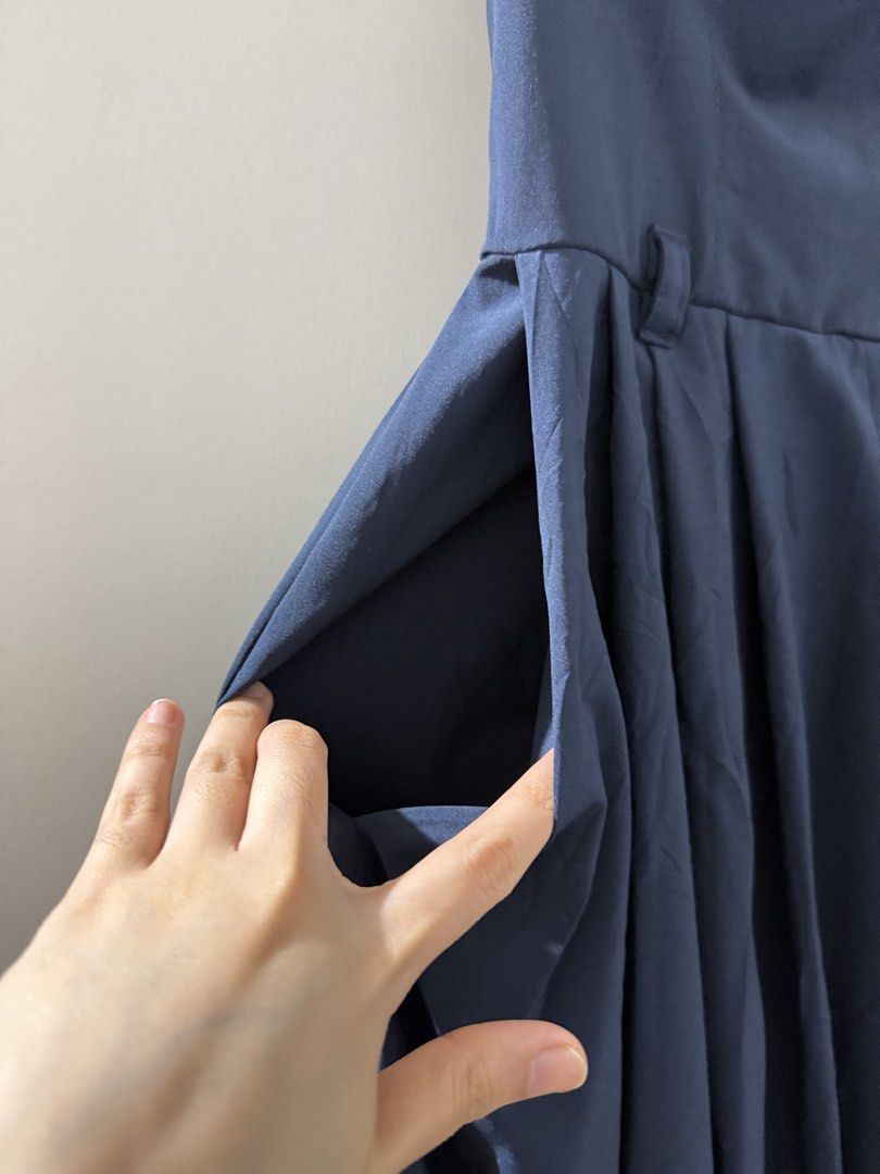 Navy Blue Strapless Maxi Dress with Pockets (Category: Dresses) located in Manila. Submitted by mnlclaudia (Listing ID 1470509447, Image 3). Description: - Color: Dark blue - Style: Strapless maxi dress with a partially pleated skirt - Features: Practical side pockets and waist belt loops - Fabric: Smooth, light, and flowy - Condition: Worn only once, carefully stored and well-maintained - Best for: Vacation getaways or casual weekend styling.