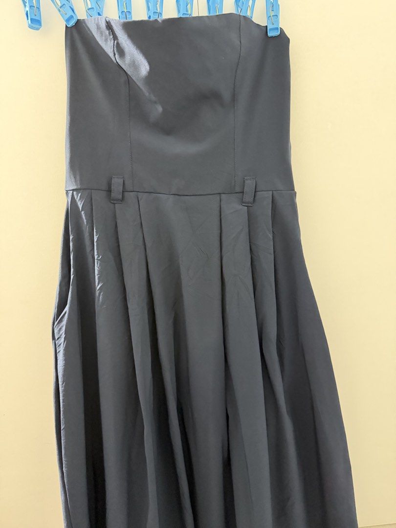 Navy Blue Strapless Maxi Dress with Pockets (Category: Dresses) located in Manila. Submitted by mnlclaudia (Listing ID 1470509447, Image 2). Description: - Color: Dark blue - Style: Strapless maxi dress with a partially pleated skirt - Features: Practical side pockets and waist belt loops - Fabric: Smooth, light, and flowy - Condition: Worn only once, carefully stored and well-maintained - Best for: Vacation getaways or casual weekend styling.