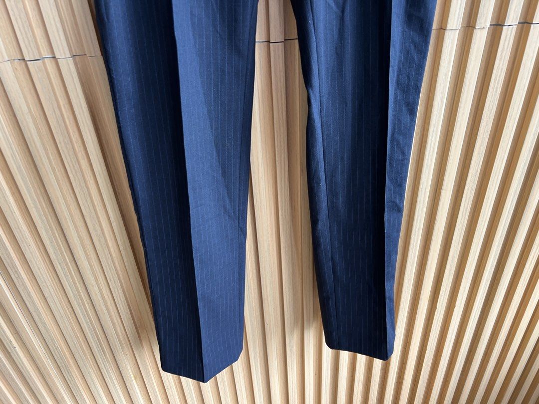 Navy Pinstripe Formal Trousers (Category: Other Bottoms) located in Lipa City. Submitted by thyra06 (Listing ID 1470370448, Image 3). Description: - Color & Pattern: Dark navy with thin vertical pinstripes - Fit & Style: Clean straight-leg cut with professional pressed creases - Details: Functional side pockets and a structured waistband - Versatility: Ideal for office wear, interviews, or formal events - Easy Pairing: Looks great matched with a 